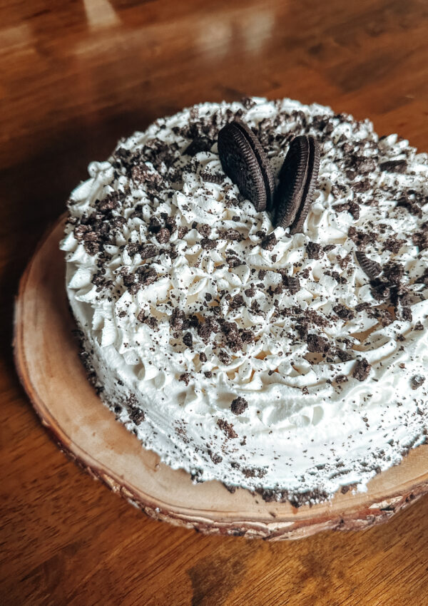 gluten free oreo ice cream cake with whipped cream and hot fudge